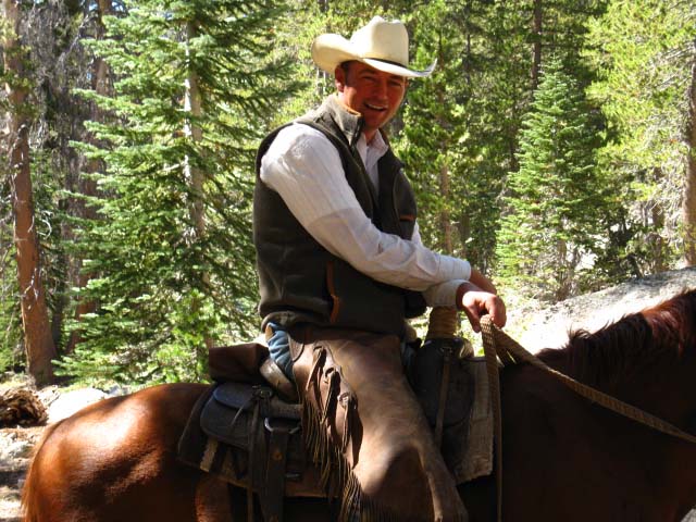 Cowboy Steve on the Pacific Crest Trail at Boulder Creek above East Carson River with three stock dogs.
