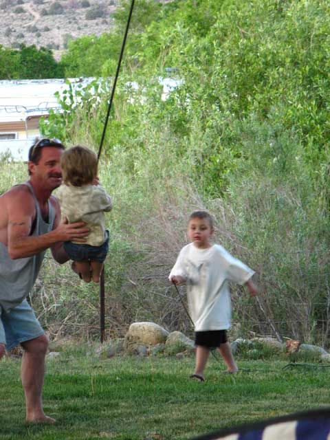 Steve introducing swinging fun to a little one.